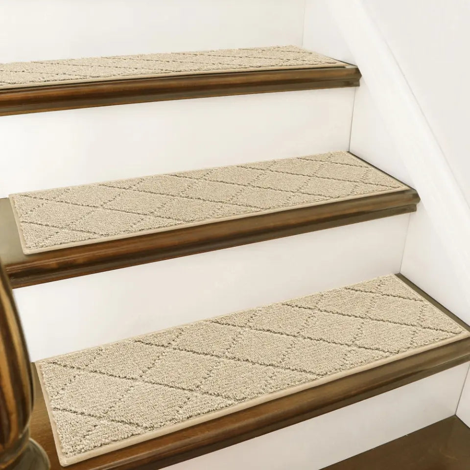 Staircase with diamond-patterned stair runners on wooden steps.