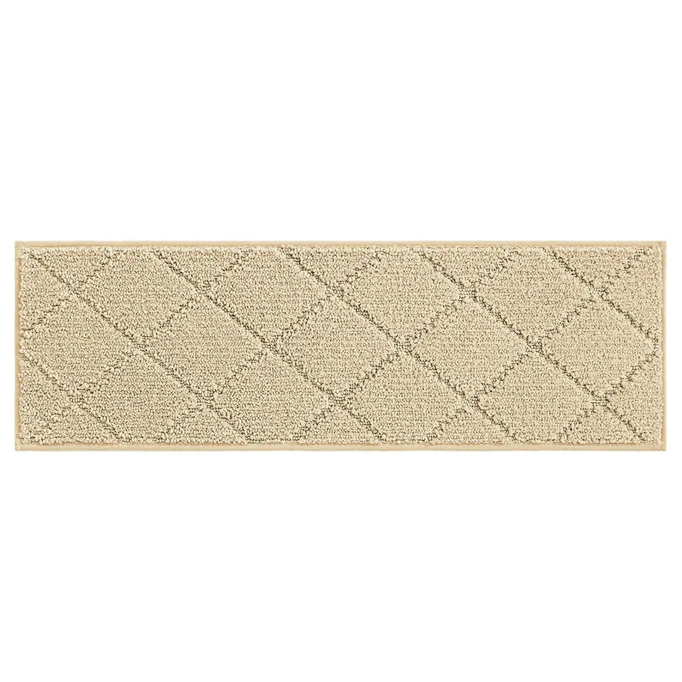 Warm beige stair treads with a diamond pattern on a white background